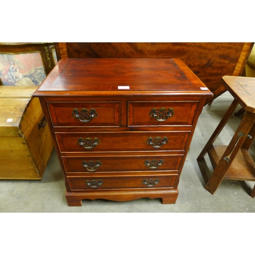 116 - A small yew wood chest of drawers