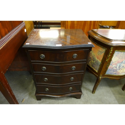 117 - A small mahogany serpentine chest of drawers