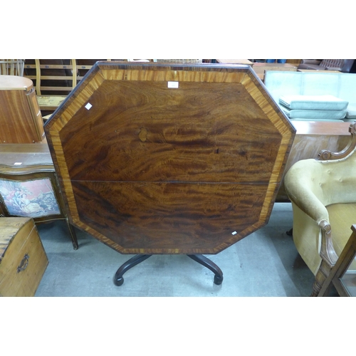 119 - A George IV mahogany octagonal tilt centre table