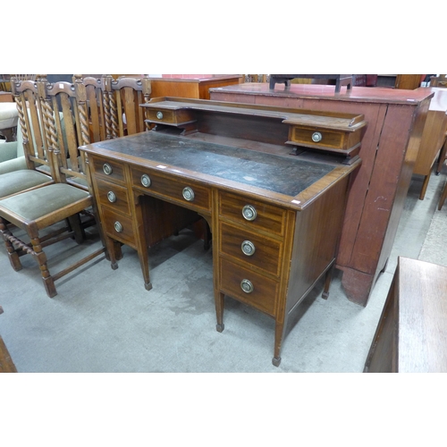 131 - A late Victorian Warings inlaid mahogany desk