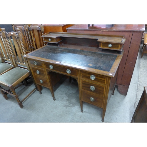 131 - A late Victorian Warings inlaid mahogany desk