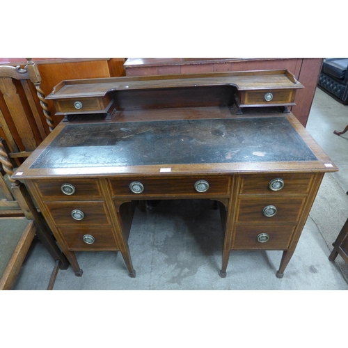 131 - A late Victorian Warings inlaid mahogany desk