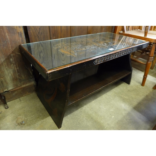 139 - An oriental carved wood coffee table