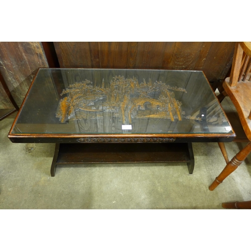 139 - An oriental carved wood coffee table