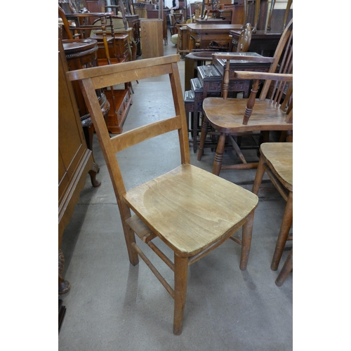 141 - A set of nine early 20th Century beech chapel chairs