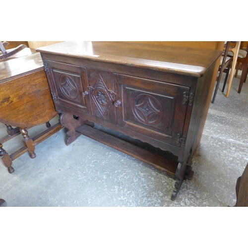 154 - A 17th Century style carved oak credence cupboard