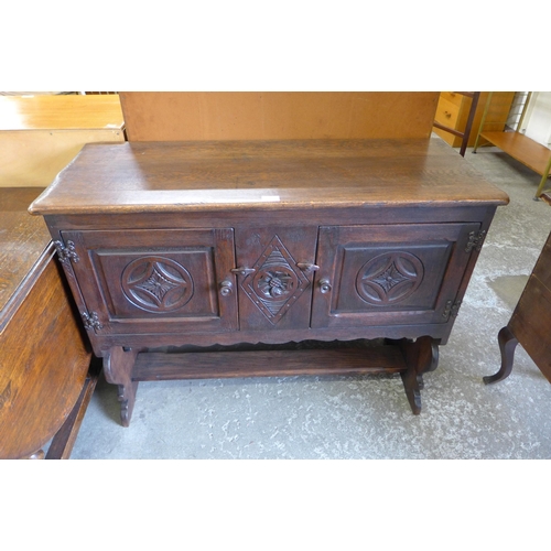 154 - A 17th Century style carved oak credence cupboard