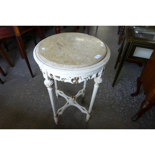 156 - A French cream and marble topped circular gueridon table