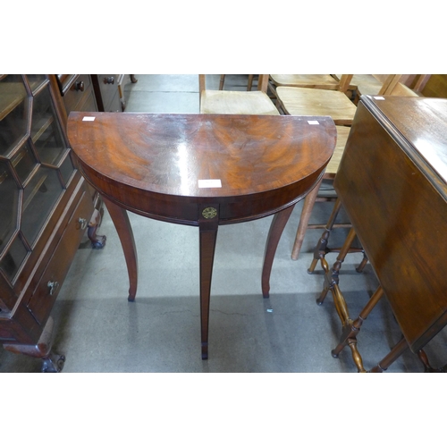 162 - A small Bevan Funnel mahogany demi lune console table