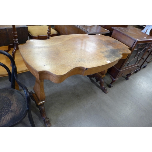 163 - A Victorian style walnut single drawer library table