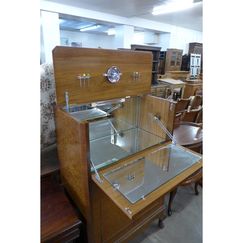 167 - A burr walnut cocktail cabinet