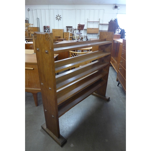 177 - A Gothic Revival carved oak open bookcase