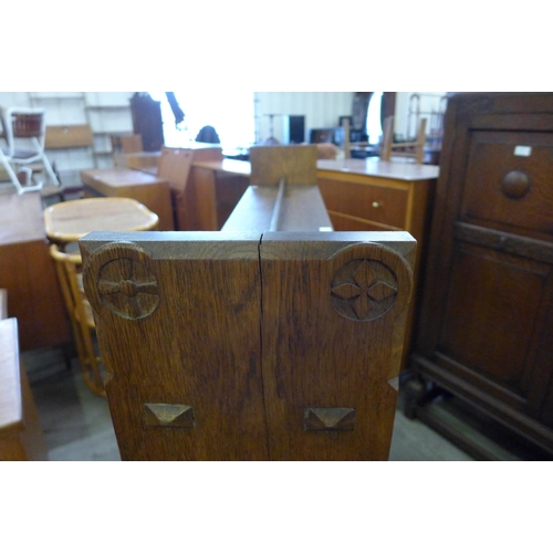 177 - A Gothic Revival carved oak open bookcase