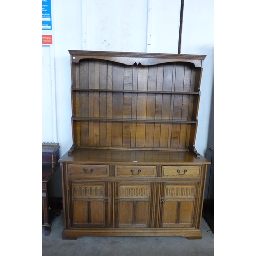 192 - A carved oak dresser