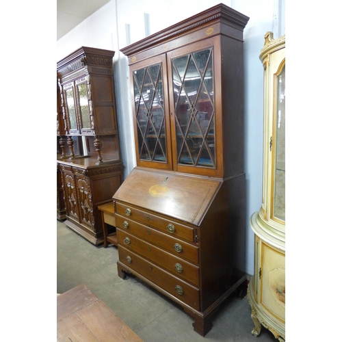 195 - A George III style inlaid mahogany bureau bookcase