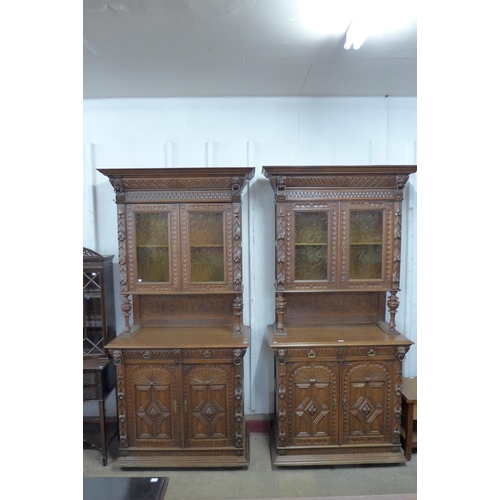 197 - A pair of 19th Century French Henry II style carved oak side cabinets