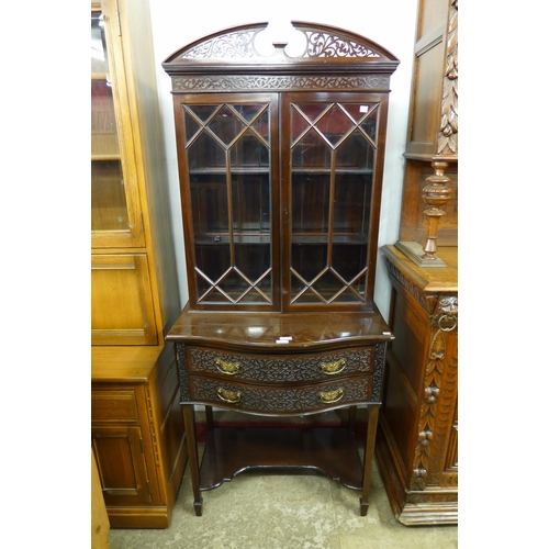 198 - An Edward VII Chippendale Revival carved mahogany serpentine side cabinet