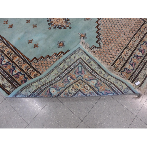 201 - An eastern turquoise ground rug