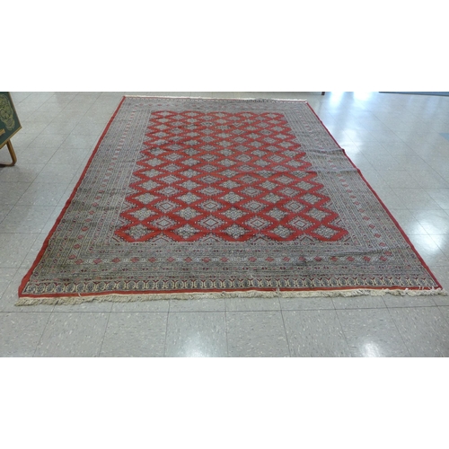 202 - An eastern red ground rug