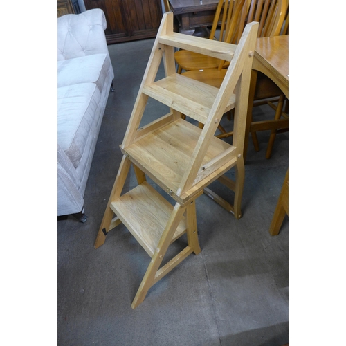 219 - A beech metamorphic library chair/steps