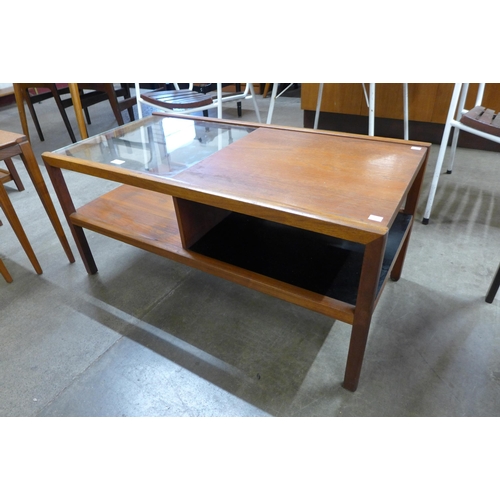 23 - A McIntosh teak and glass topped rectangular two tier coffee table