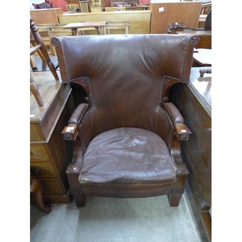 239 - A Victorian mahogany and leather upholstered armchair