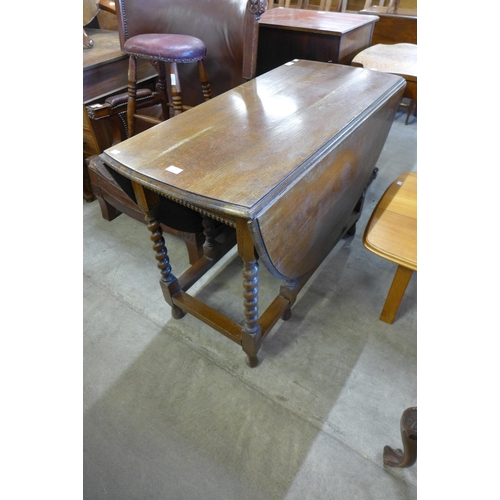 241 - An oak barleytwist gateleg table