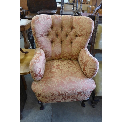 246 - A Victorian style mahogany and upholstered armchair