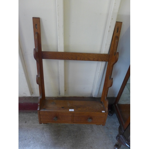 249 - A French oak wall hanging gun rack