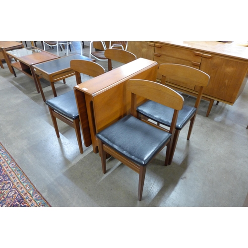 25 - A McIntosh teak drop-leaf table and four teak dining chairs