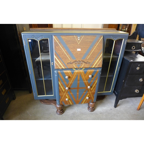 251 - A painted oak side by side bureau bookcase, an ebonised Edward VII dressing table and an inlaid maho... 