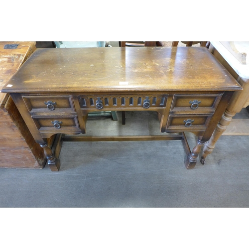 254 - A carved oak kneehole desk