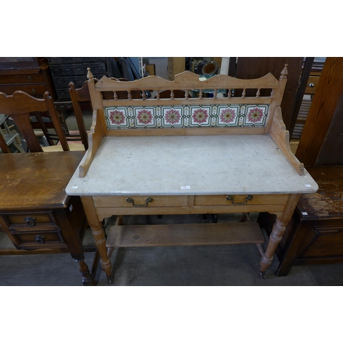 255 - A Victorian pine and marble topped washstand