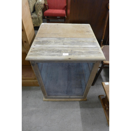 275 - An eastern hardwood and iron work folding screen and a Victorian pine meat safe