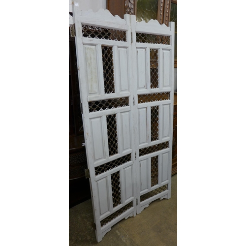 275 - An eastern hardwood and iron work folding screen and a Victorian pine meat safe