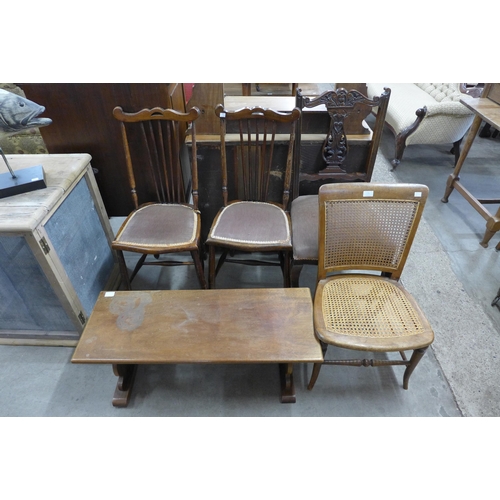 276 - Four assorted Edward VII chairs and a walnut coffee table