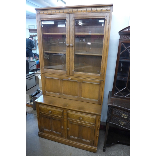 277 - An Ercol Golden Dawn elm bookcase