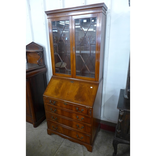 277A - A George III style mahogany bureau bookcase