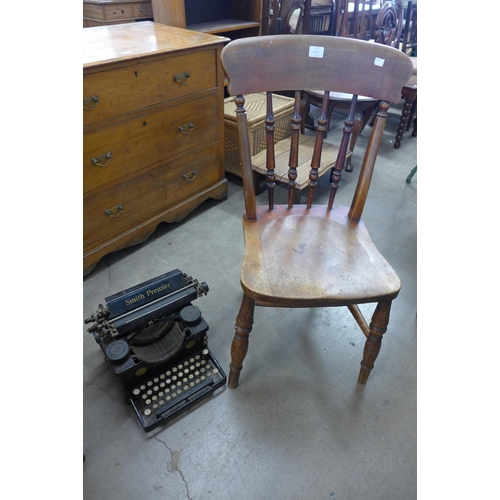 280A - A vintage Smith Premier typewriter and a Victorian elm and beech kitchen chair