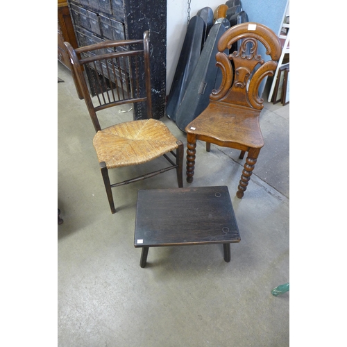 281A - A Victorian carved oak hall chair, an Arts and Crafts beech rush seated chair and an oak stool