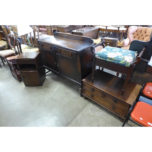 285 - A carved oak sideboard, a piano stool, pot cupboard and one other