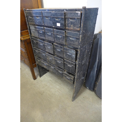 293 - An industrial steel twenty five drawer cabinet