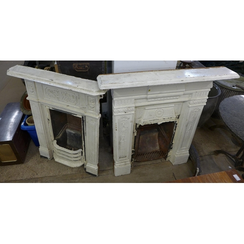 294 - Two Victorian painted cast iron fire surrounds