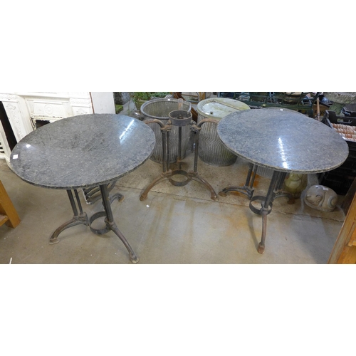 295 - A set of three cast iron based pub tables