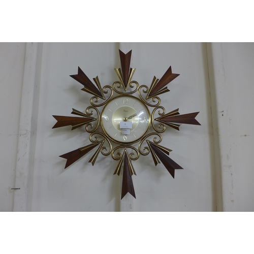 3 - A teak and brass wall clock