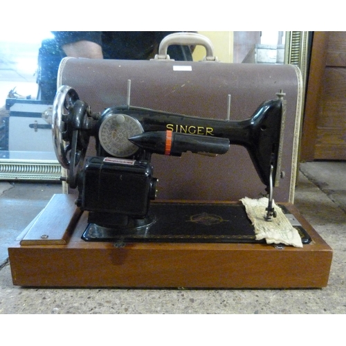 304 - A cased Singer sewing machine