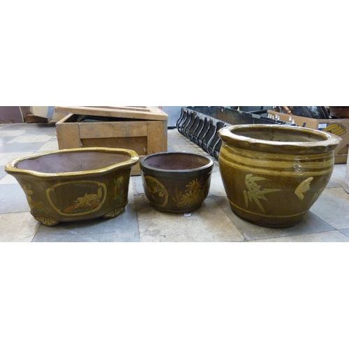 311 - Three glazed terracotta plant pots