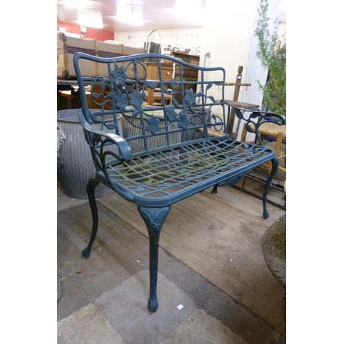 318 - A Victorian style painted cast alloy garden bench