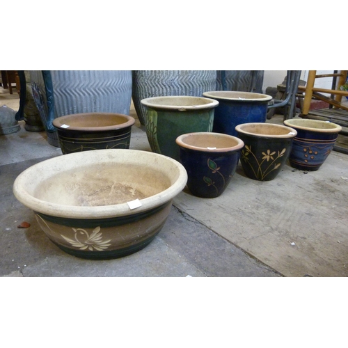 319 - Seven glazed terracotta plant pots