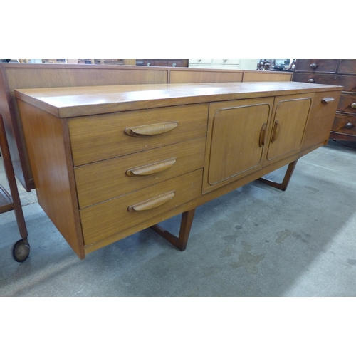 33 - A teak sideboard